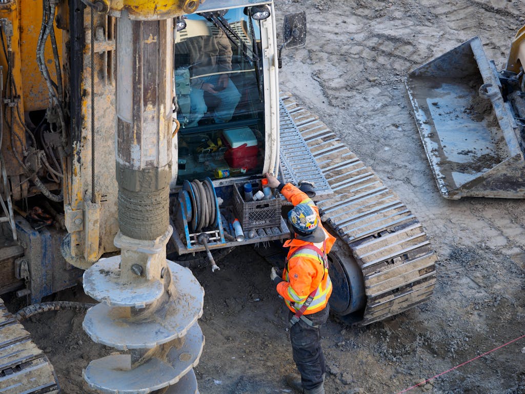 Construction Worker in Front of Bulldozer